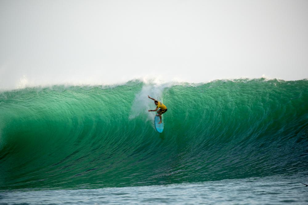 surfer on an epic bali wave